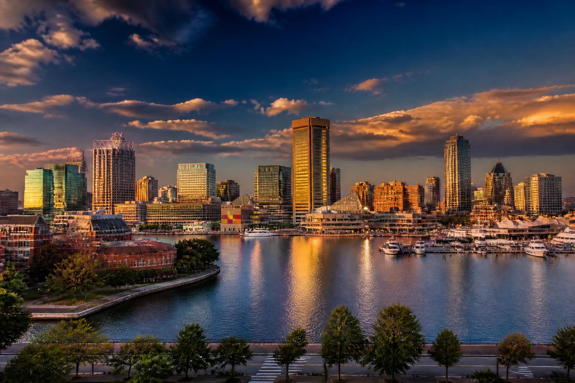 Baltimore city skyline at golden hour over the Inner Harbor